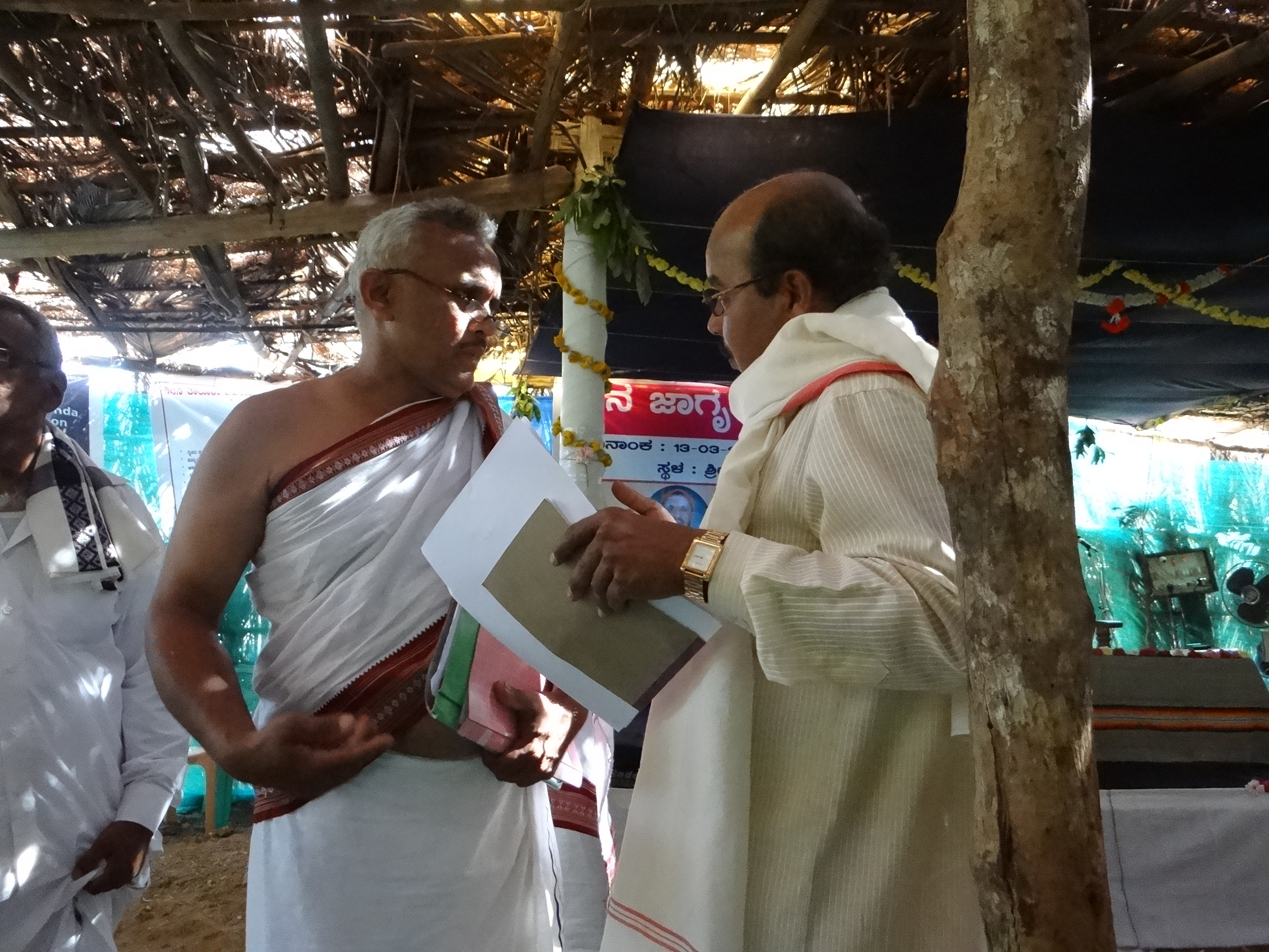 Priests earnestly discussing river protection strategies