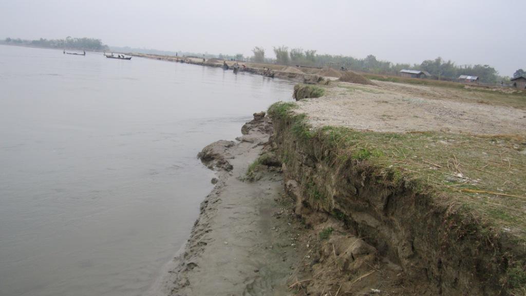 Dikrong at Dikronghat in Lakhimpur district of Assam where it erodes rapidly. The impacts of change is water flow is clearly visible. Due to release of water in upstream water at night covers the lower portion of the bank. This photo was taken around 8am in the morning when the water receded. The lower bank portion was wet in the morning. According to the local the water further recedes by the evening and again increases at night. Photo: Parag Jyoti Saikia 