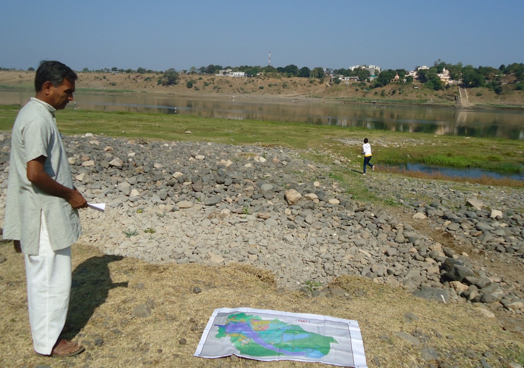 River Narmada from Indravarna village which will be affected due to  construction of Garudeshwar dam. The map on the ground speaks volumes about locked between two dams and a river in reality.  