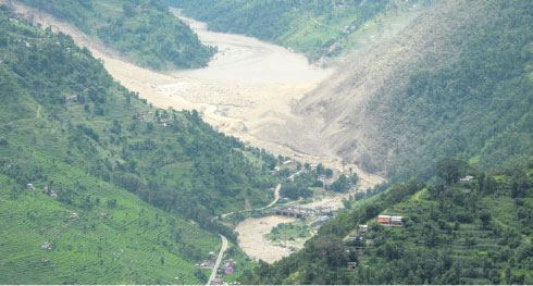 A view of water flowing out of landslide dam, photo from myrepublica.com