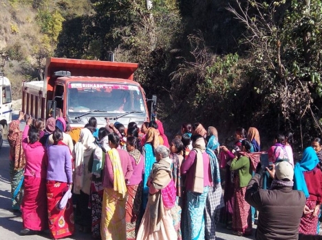 Maletha women stopping truck from transporting stones to crusher units