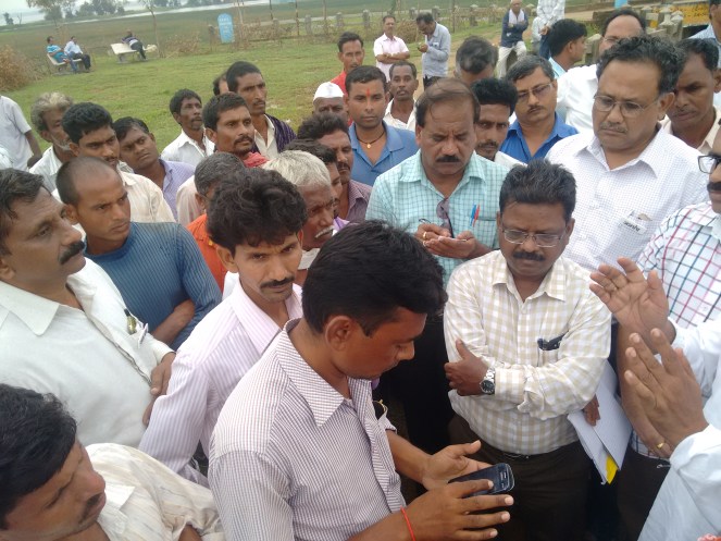 Kushal Lode trying to show a photo of complaint submitted to VIDC