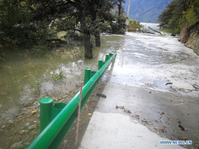 Photo taken on Oct. 18, 2018 shows a road partially submerged by the landslide-caused barrier lake on the Yarlung Tsangpo River in Menling County, southwest China's Tibet Autonomous Regi