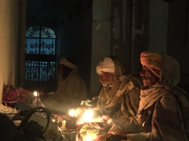 Parikramavasis performing the daily aarti in a temple
